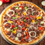Five-Meat-Pizza-with-cooked-ground-beef-crumbled-souseges-crumbled-bacon-sliced-peperoni-mozzarella-glazed-onions-and-cooked-sliced-bell-pappers